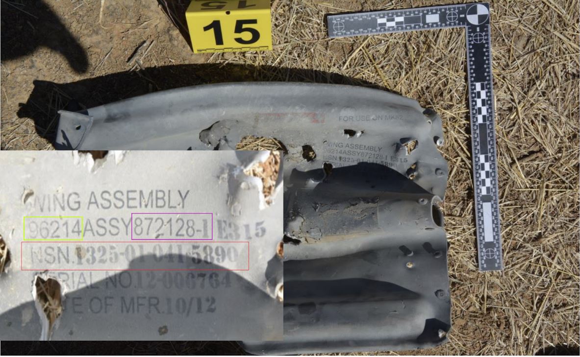 Ci-contre, l'annexe 9 du rapport de la Minusma. Un fragment du missile est visible, ainsi que les inscriptions, qui montrent le code CAGE (jaune), le numéro de produit (violet) et le NSN (rouge).