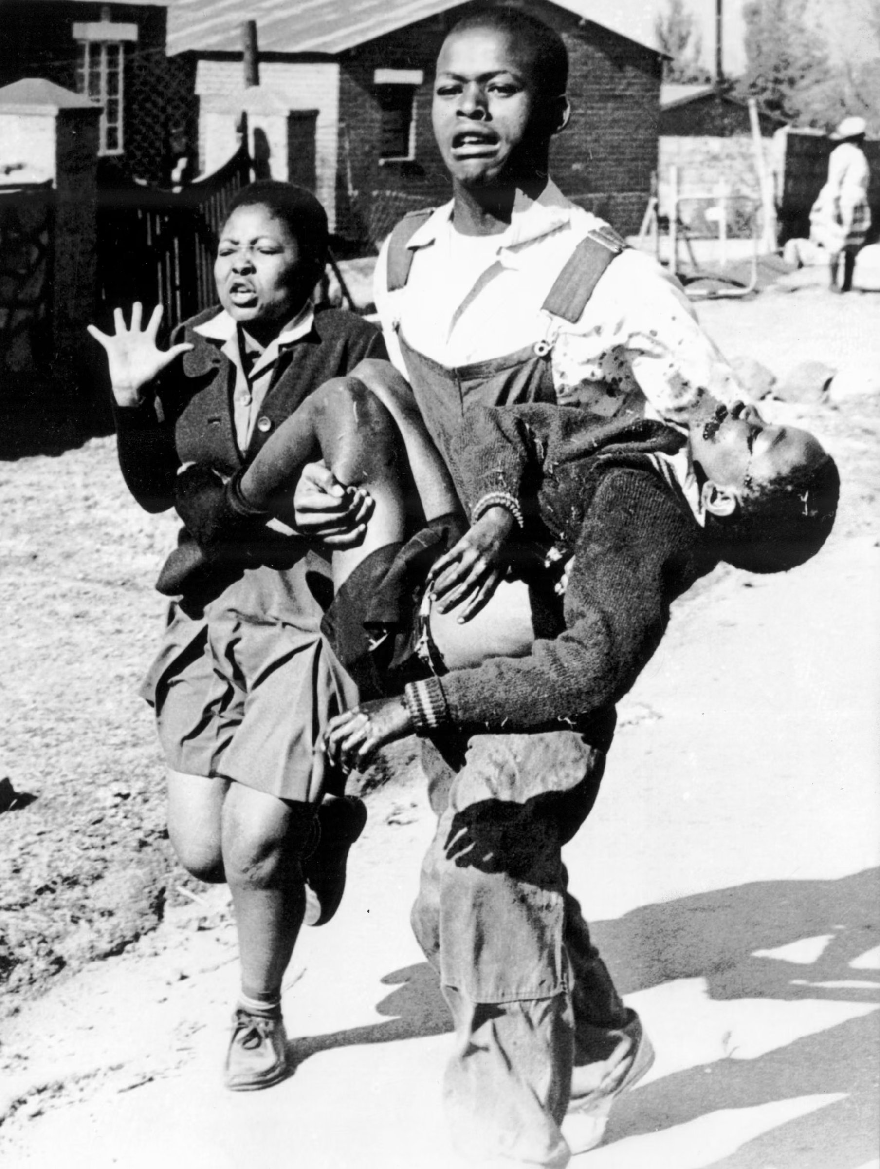 Hector Pieterson, held in the arms of Mbuyisa Makhubo, while Hector's distraught sister, Antoinette, looks on, June 16, 1976.
