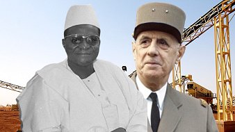 The image appears to show two historical figures in front of a background featuring industrial equipment, likely related to mining or construction. One figure is depicted in black and white, dressed in traditional attire, while the other is shown in color, wearing a military uniform and a distinctive hat. The setting suggests a focus on industrial development or political themes, potentially highlighting a historical connection between these individuals.