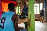 Fidèle et Placide, 22 ans, dans une église pentecôtiste sur l'île de Gihaya (lac Kivu), le 21 mars 2024.