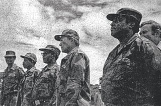 Modise, right, in a camp in Angola with a Soviet officer and Oliver Tambo, circa 1969. 